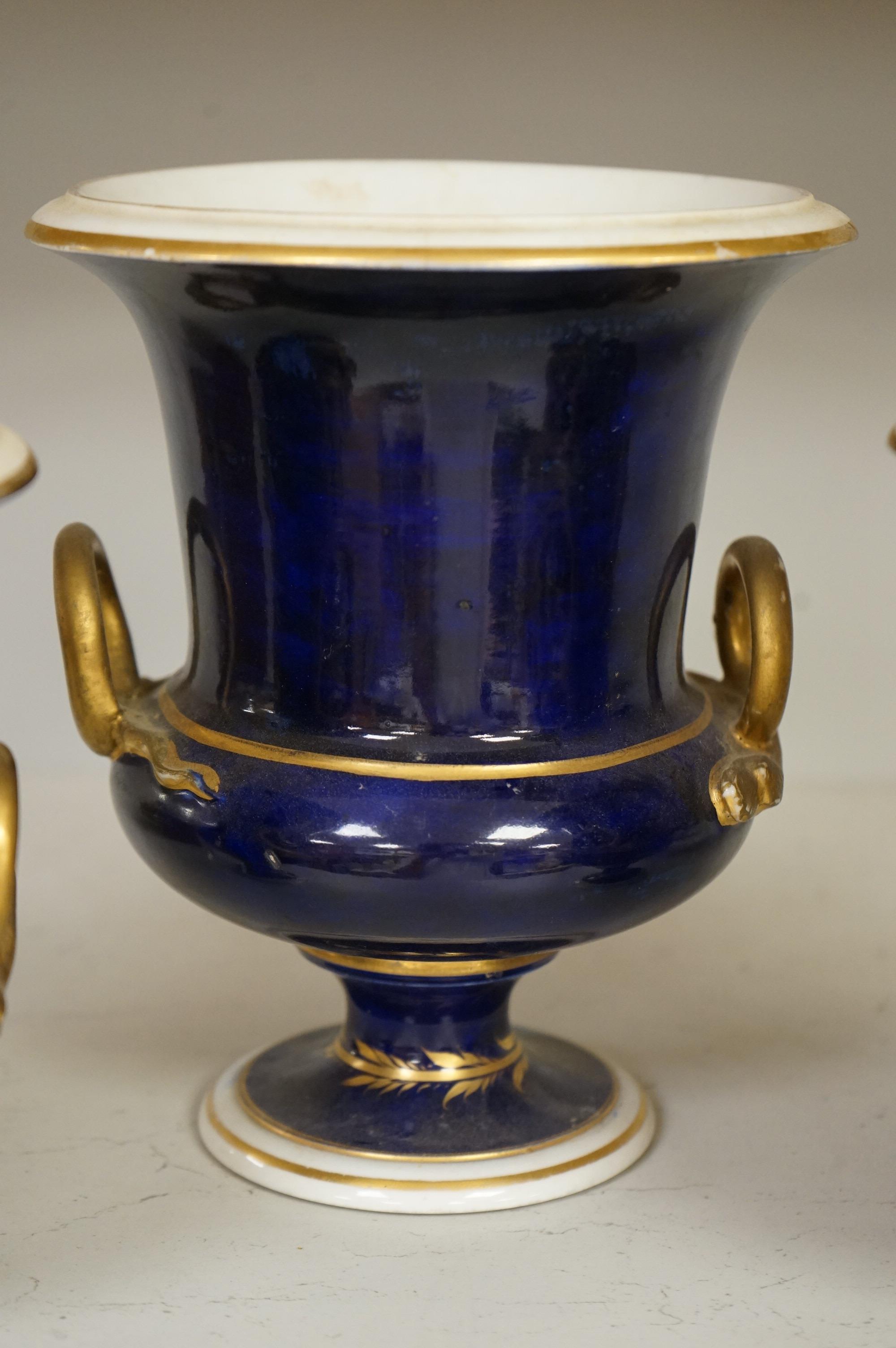A set of three Derby campana vases, painted with named views, circa 1820, tallest 20.5cm